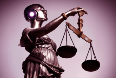 A statue of lady justice is transformed by a female android with the thinktum circle on her ear holds the scales of justice aloft.